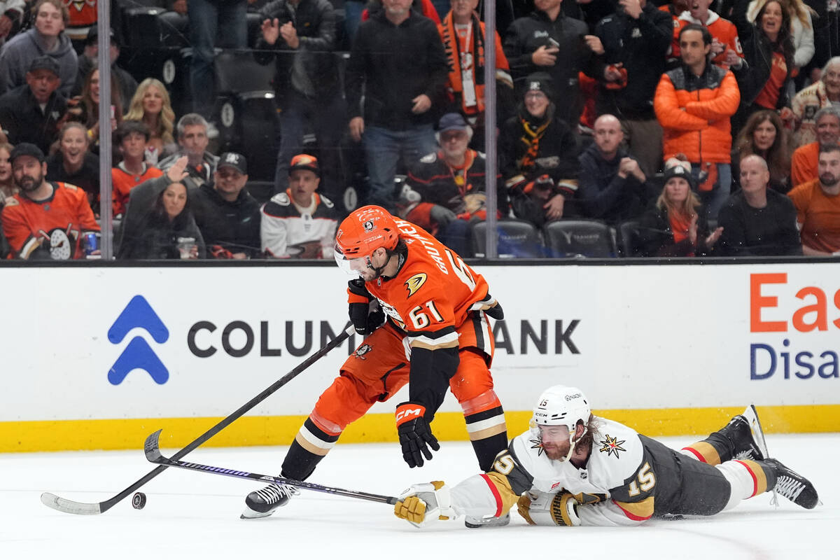 With an empty net, Vegas Golden Knights' Noah Hanifin (15) breaks up a scoring chance by A ...