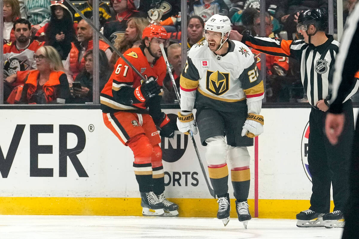 Vegas Golden Knights defenseman Shea Theodore, right, celeb rates his goal as Anaheim Ducks lef ...
