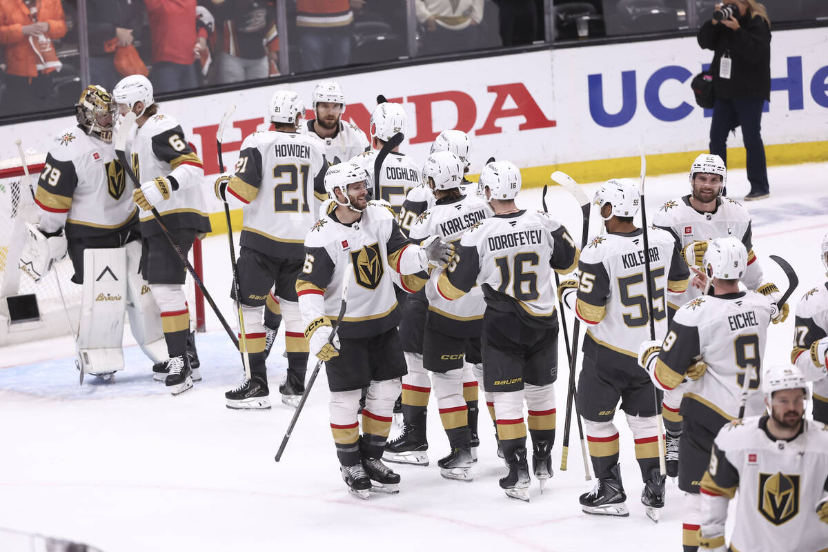 The Golden Knights celebrate after winning their NHL hockey Stanley Cup second-round playoff se ...