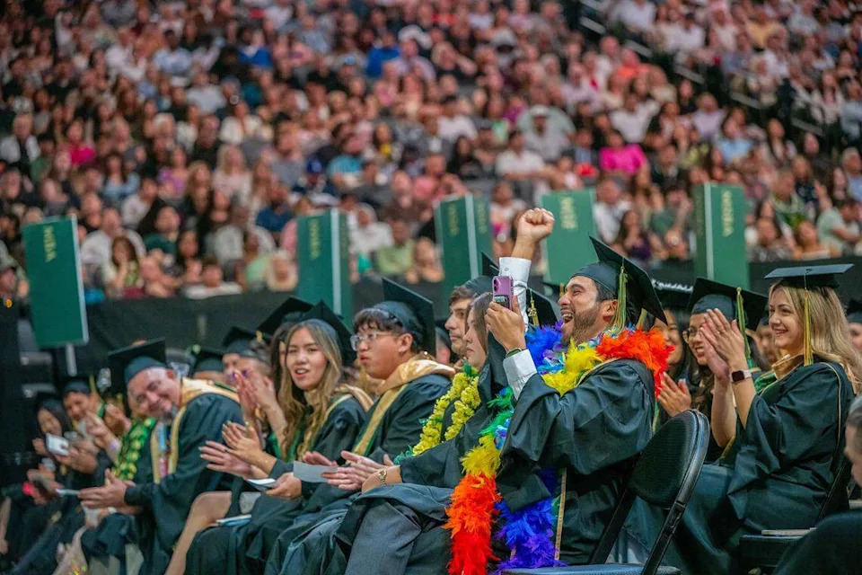 Richard Kiki Angulo, executive vice president of Associated Students Inc., celebrates after his name is called during one of Sacramento State’s commencement ceremonies at Golden 1 Center on Friday, May 22, 2026.