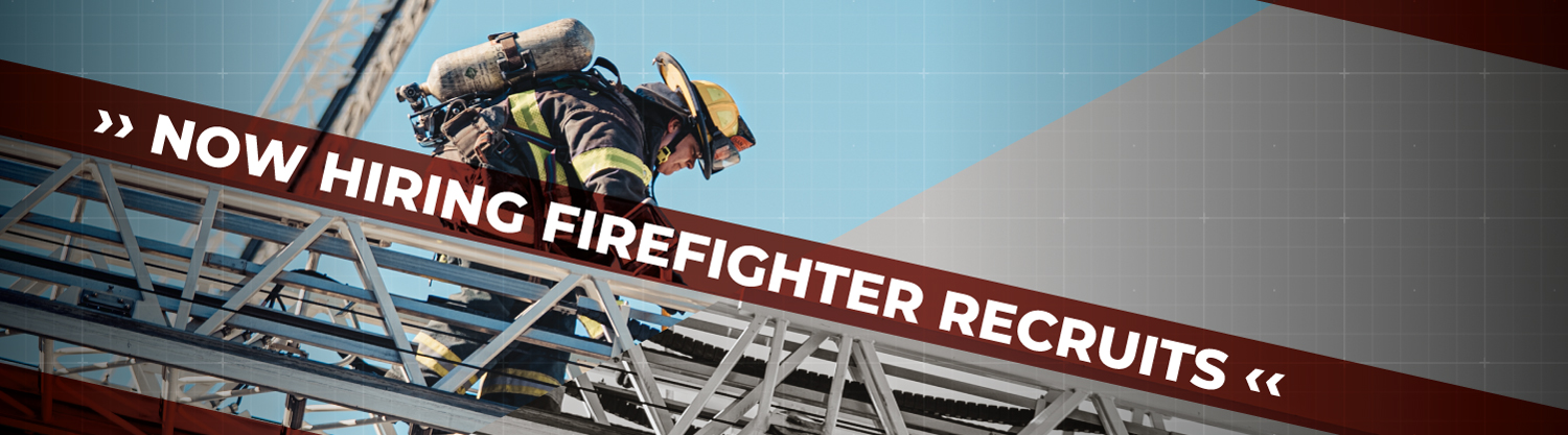A firefighter recruit walking on an aerial ladder.