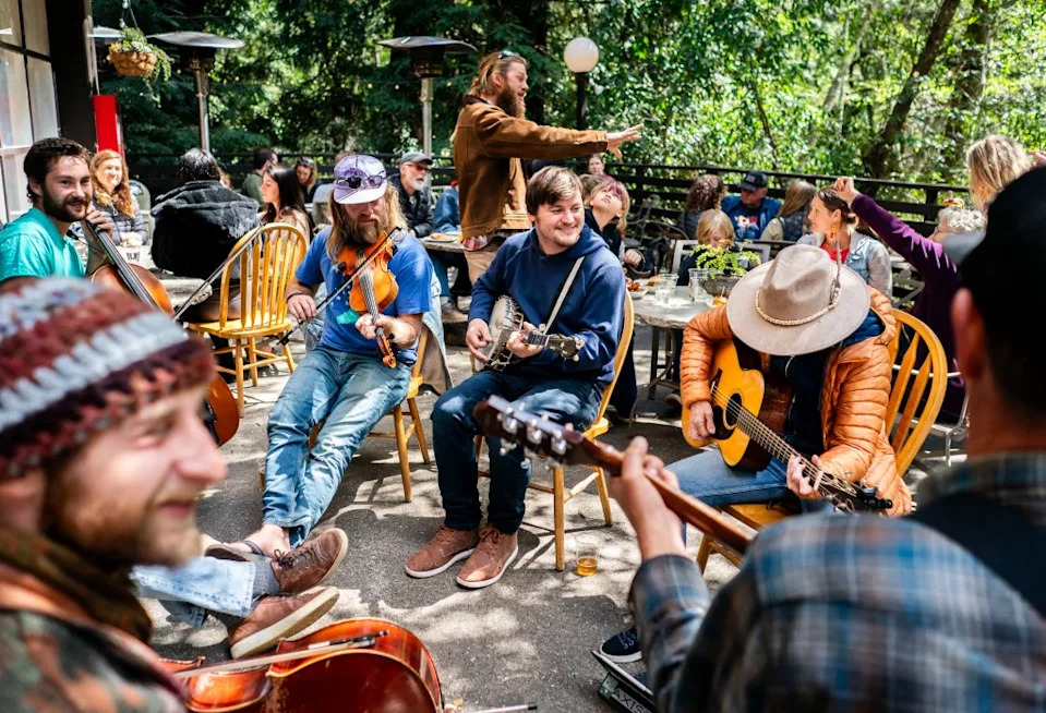 Local musicians play for residents and essential workers at Pfeiffer State Park. The Washington Post via Getty Images