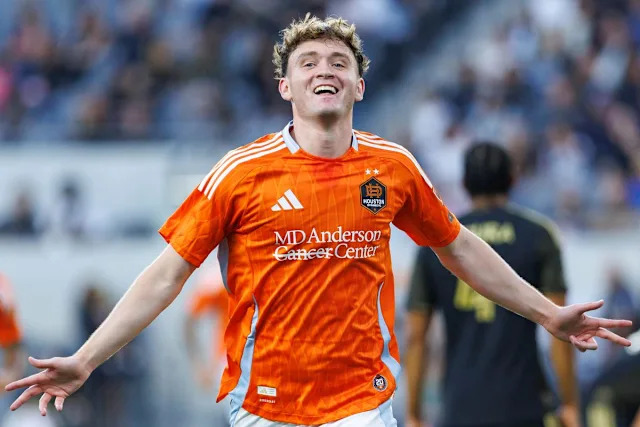 Jack McGlynn #8 of Houston Dynamo FC celebrates after scoring a goal during an MLS match against LAFC on May 10, 2026 at BMO Stadium in Los Angeles, California.