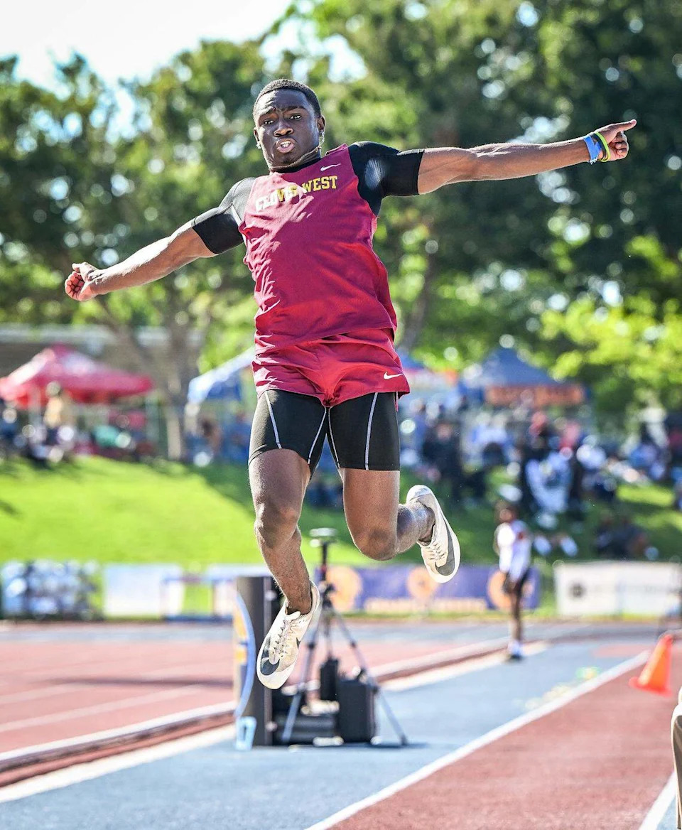 Clovis West's Julius Sanders takes flight in the boys' long jump during the CIF state track and field championships at Veterans Memorial Stadium in Clovis on Saturday, May 30, 2026. Sanders won the event.