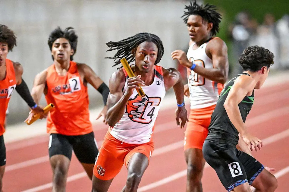 Central's Emanuel Morgan, center, takes the baton from teammate Xavior Jones in the boys' 1600 relay during the CIF state track and field championships at Veterans Memorial Stadium in Clovis on Saturday, May 30, 2026. The Central East team finished third.