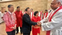 Bishop Michael Pham welcomes other clergy to the multicultural mass he created nine years ago whe he was still a priest, May 23, 2026.