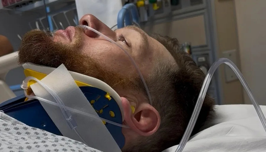 Jeffrey Garmany is seen in a hospital after the crash.