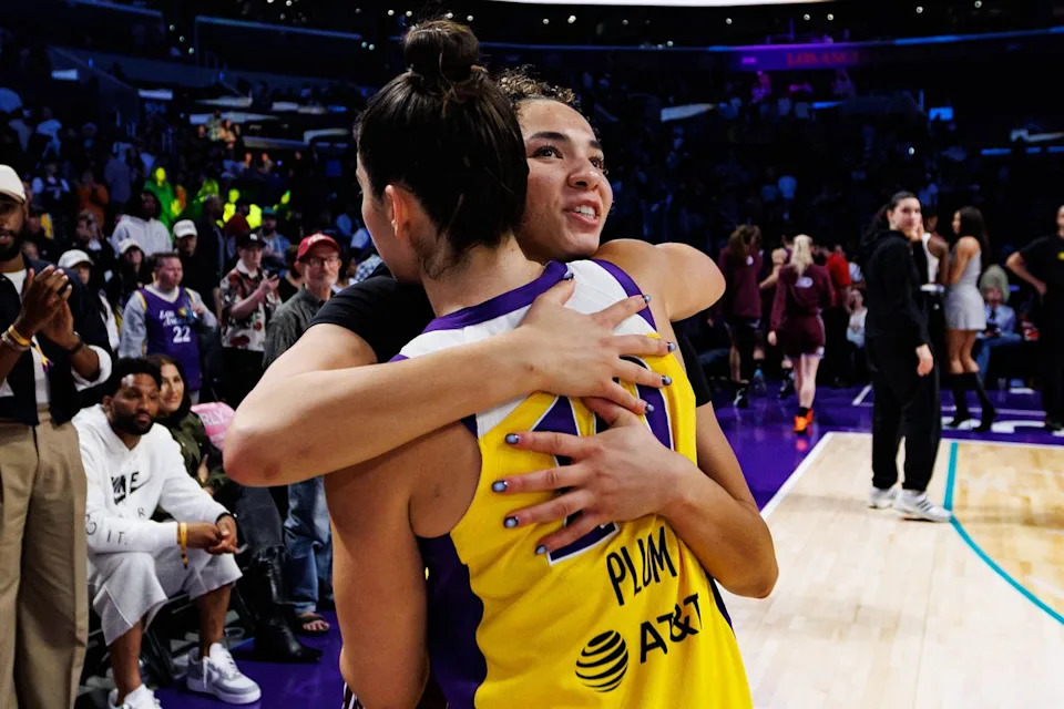 Kelsey Plum #10 of the Los Angeles Sparks hugs Kiki Rice #1 of the Toronto Tempo after a WNBA game against the Toronto Tempo on May 15, 2026 at Crypto.com Arena in Los Angeles, California.