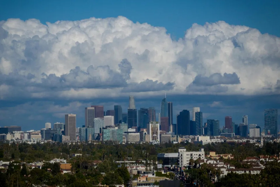 Clouds over an area of tall buildings.