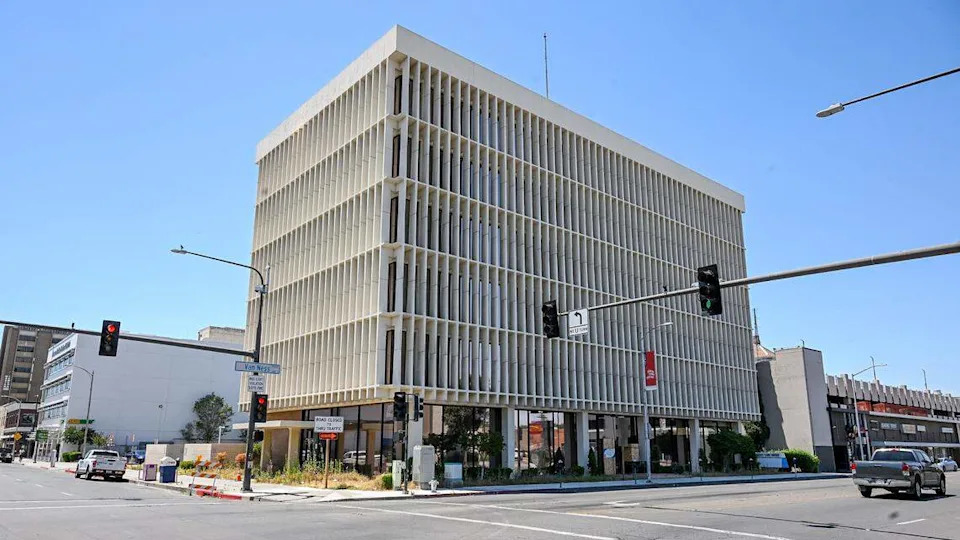The former BMO Bank building at the corner of Van Ness Avenue and Fresno Street is listed for sale at an asking price of $2.6 million. The building, built in 1967, is six stories high and 47,040 square feet and is one of the more recognizable buildings in the area with its mid-century modern architecture.