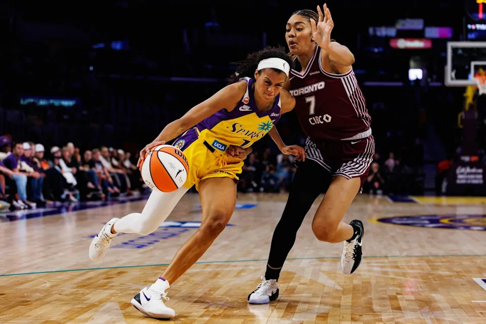 Rae Burrell #12 of the Los Angeles Sparks drives in with the ball during a WNBA game against the Toronto Tempo on May 15, 2026 at Crypto.com Arena in Los Angeles, California.