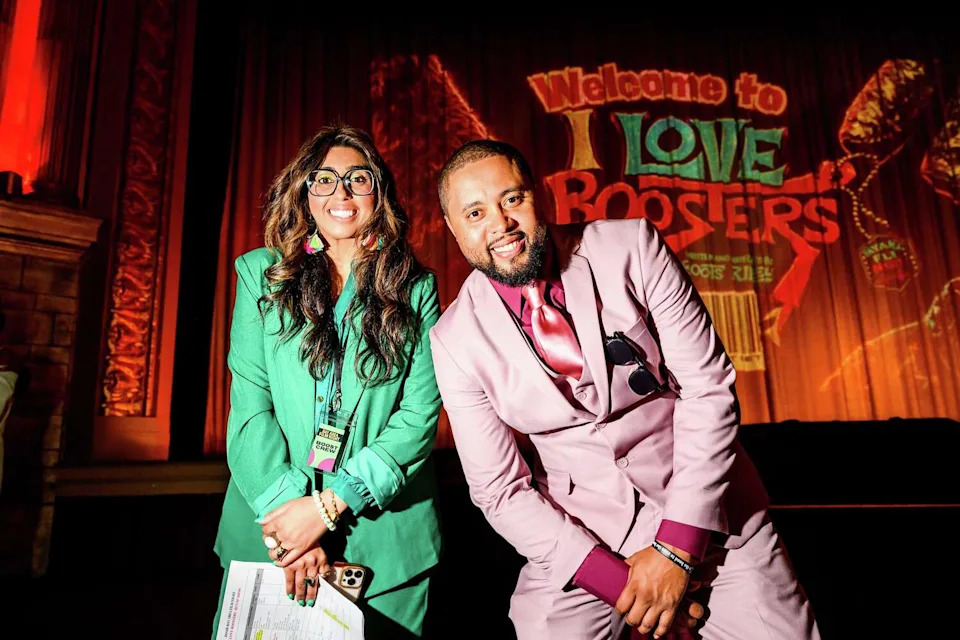 Rippin Sindher, Executive Director of Bay Area Film Night, left, and Bay Area Film Night organizer Jamal Trulove prepare to kick off a showing of "I Love Boosters" at the Grand Lake Theatre in Oakland, Thursday, May 21, 2026. (Noah Berger/For the S.F. Chronicle)