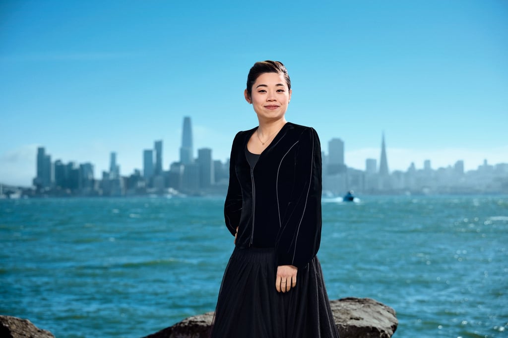 Elim Chan, who has recently conducted the BBC Proms and major orchestras in Chicago, New York and Boston, in front of the San Francisco skyline. Photo: Cody Pickens
