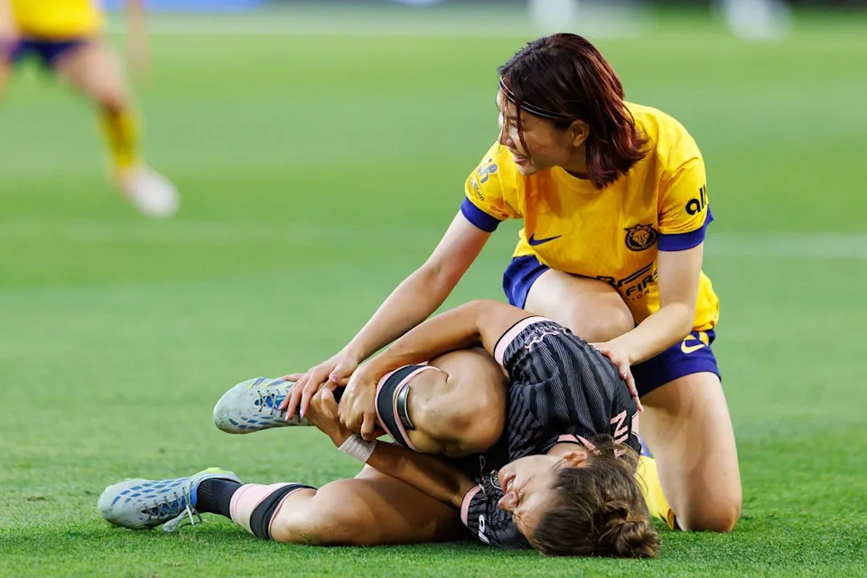 Miyabi Moriya #22 of the Utah Royals takes down Nealy Martin #14 of Angel City FC during an NWSL match against Angel City FC on May 2, 2026 at BMO Stadium in Los Angeles, California.