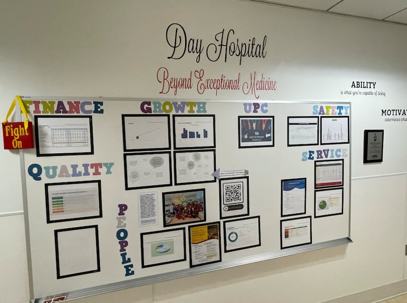 Performance charts and a motivational sign line the walls of USC Norris Cancer Center’s Day Hospital. (Photo by Milan Zadeh)
