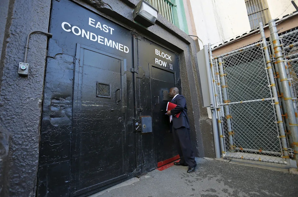 Lieutenant Sam Robinson knocking on a door at San Quentin State Prison death row