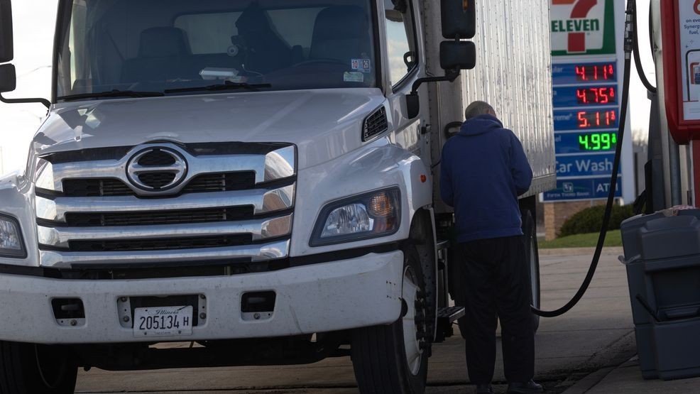 FILE - A driver buys diesel fuel for his truck at a tollway oasis on April 6, 2026, in Belvidere, Illinois. (Photo by Scott Olson/Getty Images)