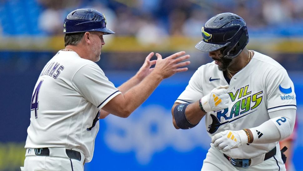 Tampa Bay Rays' Yandy Díaz celebrates his home run off Los Angeles Angels pitcher Walbert Ureña with third base coach Brady Williams (4) during the first inning of a baseball game Friday, May 29, 2026, in St. Petersburg, Fla. (AP Photo/Chris O'Meara)