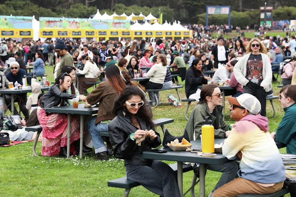 Fans enjoy food during Outside Lands in San Francisco's Golden Gate Park on Aug. 9, 2024. The festival's 2026 food and drink lineup will feature 100 Bay Area restaurants. (Jessica Christian/The Chronicle)