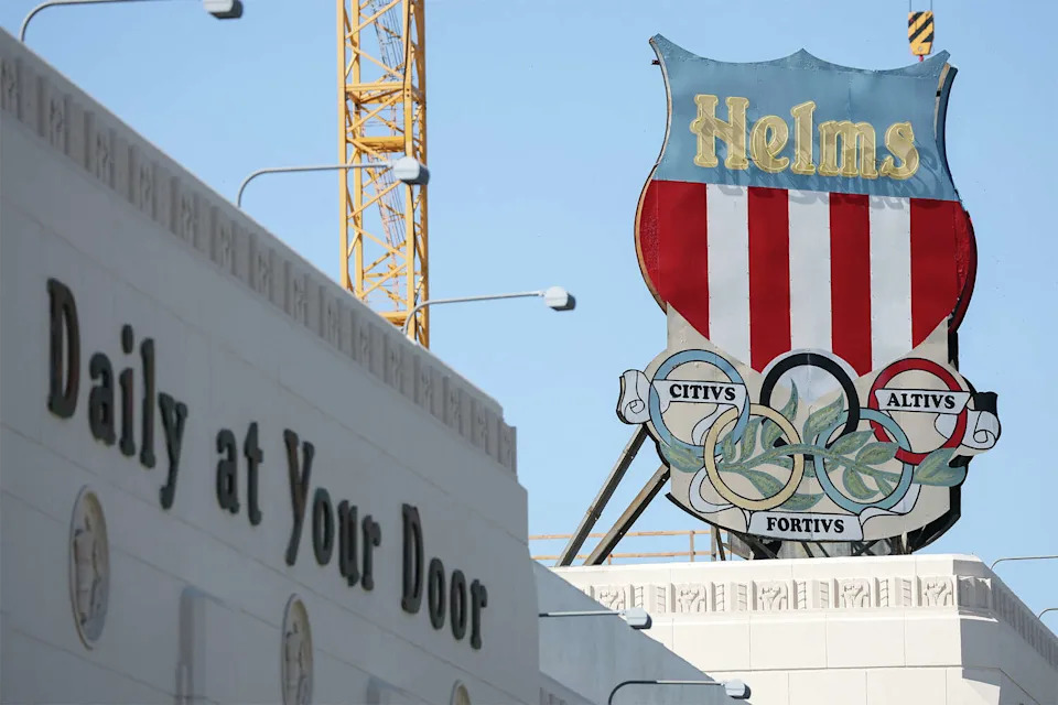 The historic Helms Bakery Olympic rings shield logo is displayed outside the Ikea store in Culver City's Helms Design District in Los Angeles County, Calif., on April 29, 2026. (Patrick T. Fallon/AFP/Getty Images)