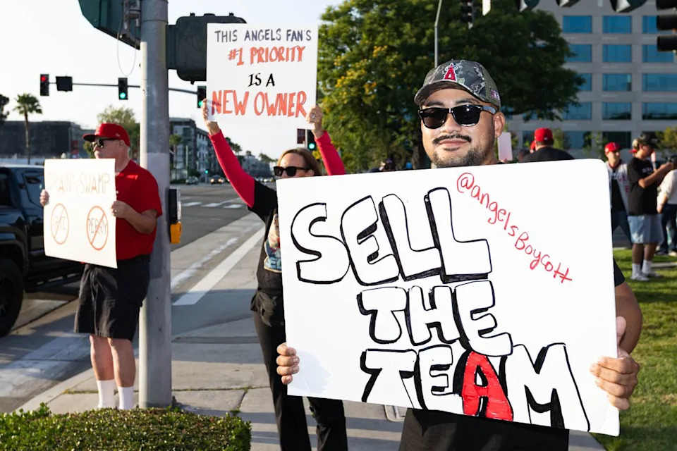 Los Angeles Angels fans protest against Arte Moreno to sell the team before an MLB game against the Texas Rangers on May 23, 2026 at Angel Stadium in Anaheim, California.