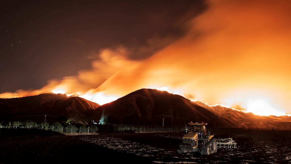 Twin California wildfires surge in Riverside County as evacuation zones hold under dangerous weather
