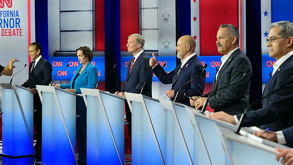 Democratic candidates Antonio Villaraigosa, Katie Porter, Tom Steyer and Xavier Becerra and Republican candidates Steve Hilton and Chad Bianco standing on stage at a California gubernatorial debate