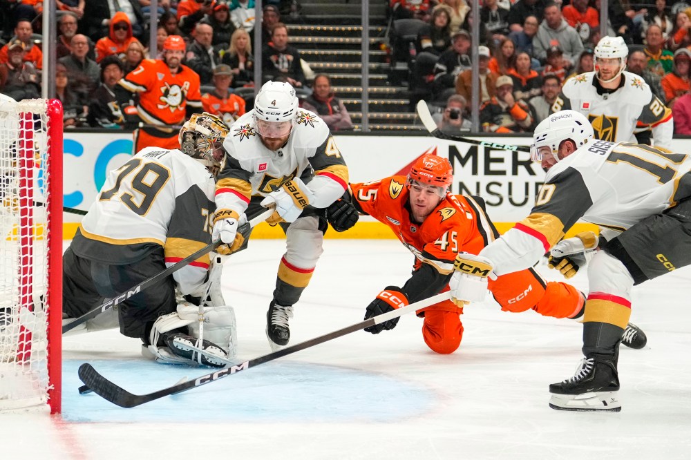 Anaheim Ducks right wing Beckett Sennecke, second from right, scores as Vegas Golden Knights goaltender Carter Hart, left, watches and defenseman Rasmus Andersson, second from left, and center Colton Sissons try to defend during the third period in Game 3 of a second-round NHL hockey Stanley Cup playoff series Friday, May 8, 2026, in Anaheim, Calif. (AP Photo/Mark J. Terrill)