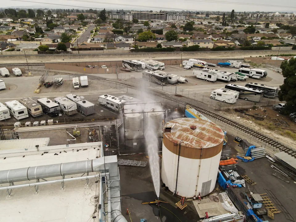 A drone view shows water being sprayed during a chemical incident involving a leaking tank of methyl methacrylate, a flammable liquid used in the aerospace industry, forcing an estimated 40,000 to evacuate in the area surrounding Garden Grove, California, May 23, 2026.