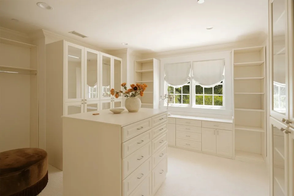 Then there are the <em>two</em> walk-in closets, one of which features a sizable island at its center, ideal for storing accessories. <span class="image-credit">(Christian Cruzio Studios)</span>