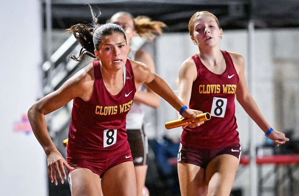 Clovis West's Ryleigh Schoonover, left, takes the baton from teammate Alison Ivy in the girls' 1600 relay during the CIF state track and field championships at Veterans Memorial Stadium in Clovis on Saturday, May 30, 2026.