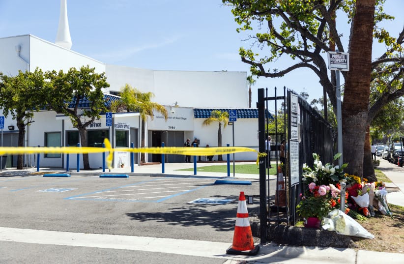 Flowers placed by local residents are seen a day after a shooting at the Islamic Center of San Diego in California, on May 19, 2026.