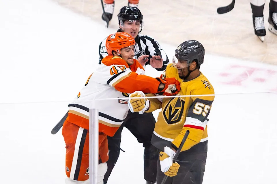 Anaheim Ducks center Tim Washe (42) shoves Vegas Golden Knights right-wing Keegan Kolesar (55) during game 2 of a NHL playoff game between the Vegas Golden Knights and the Anaheim Ducks, Wednesday May 6, 2026 in Las Vegas, Nev.