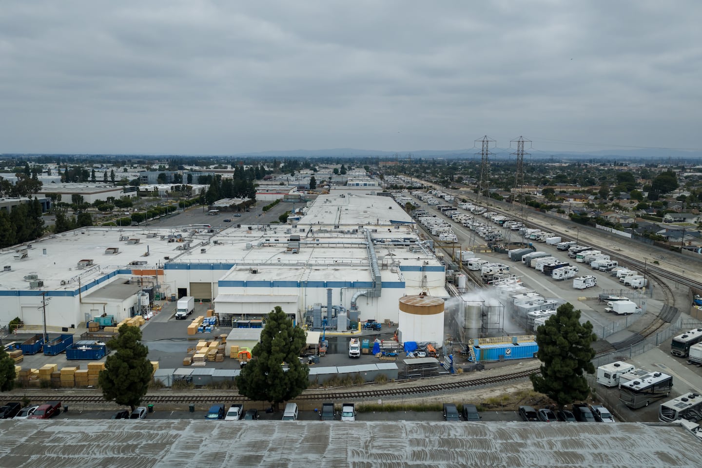 Water is sprayed on a damaged tank at GKN AerospaceT n Garden Grove, Calif., on May 24, after the tank containing a chemical used to make plastic parts overheated Thursday.