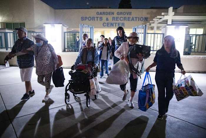Evacuation centers fill up in southern California as efforts continue to cool damaged chemical tank