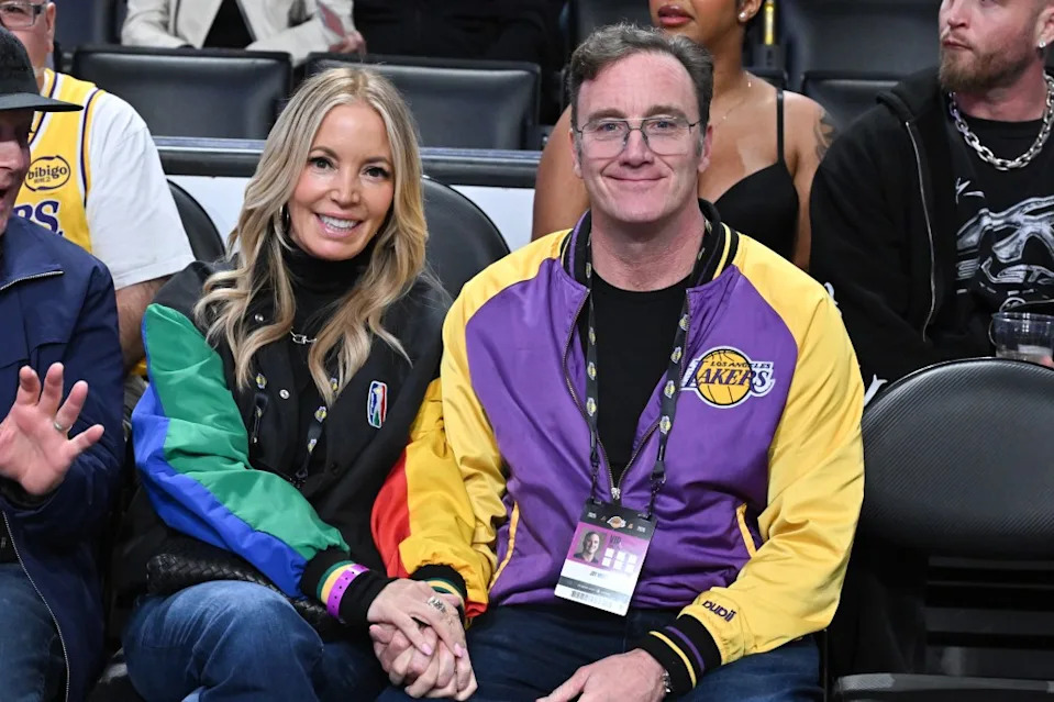 Jeanine Buss [left] and husband Jay Mohr [right] sit courtside at a Lakers game. Getty Images