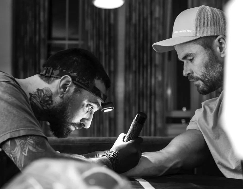 Dillon Forte tattooing Australian actor Chris Hemsworth. (Courtesy of Dillon Forte)