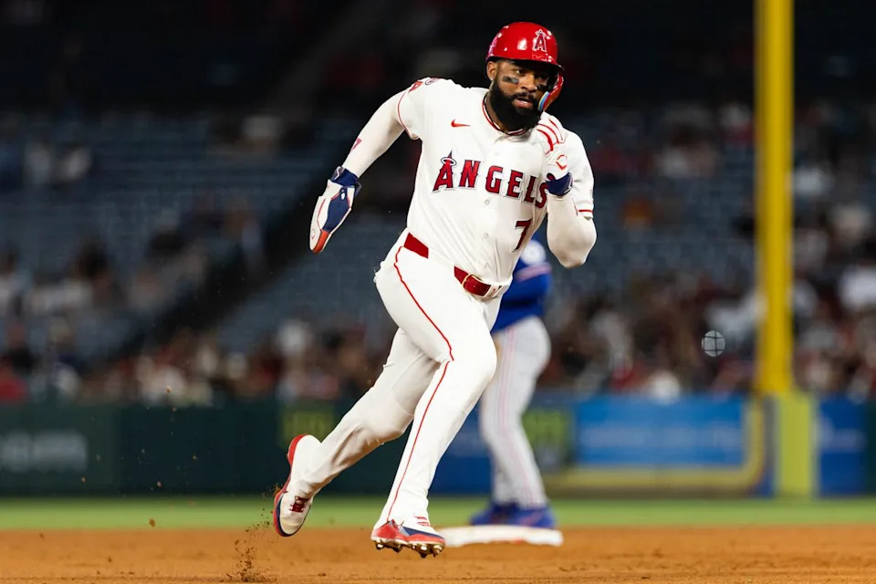 Jo Adell #7 of the Los Angeles Angels runs to third base during an MLB game against the Texas Rangers on May 23, 2026 at Angel Stadium in Anaheim, California.
