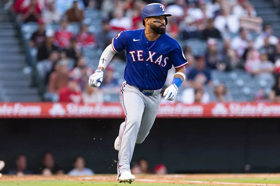 Ezequiel Durán #20 of the Texas Rangers runs to first base during an MLB game against the Los Angeles Angels on May 23, 2026 at Angel Stadium in Anaheim, California.