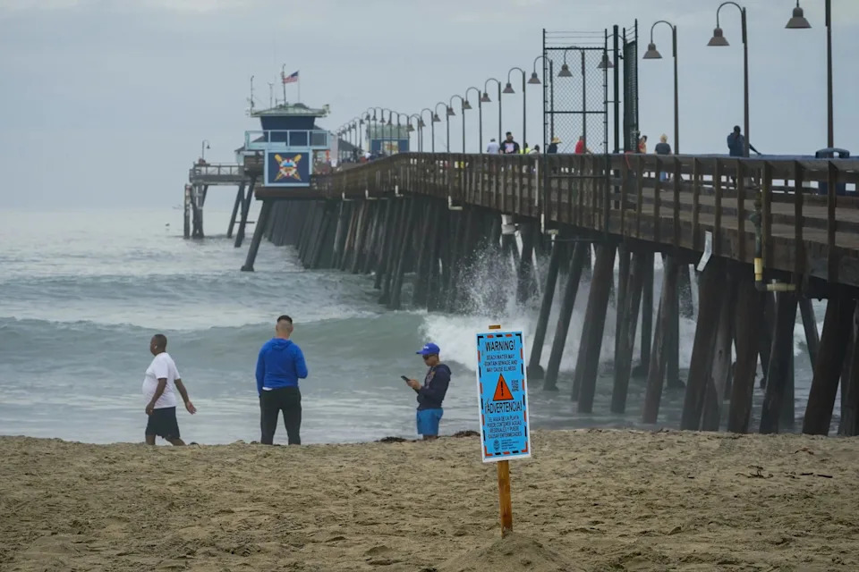 Imperial Beach, CA - September 10: On Saturday posted warning signs at Imperial Beach from County of San Diego Environmental Health and Quality warn the public of the possibility of sewage in the beach water.