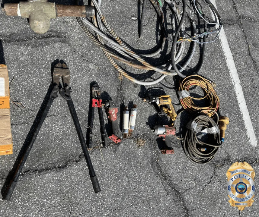 Recovered copper wiring, brass, tools and burglary equipment seized by Long Beach police during a copper theft investigation in May 2026.