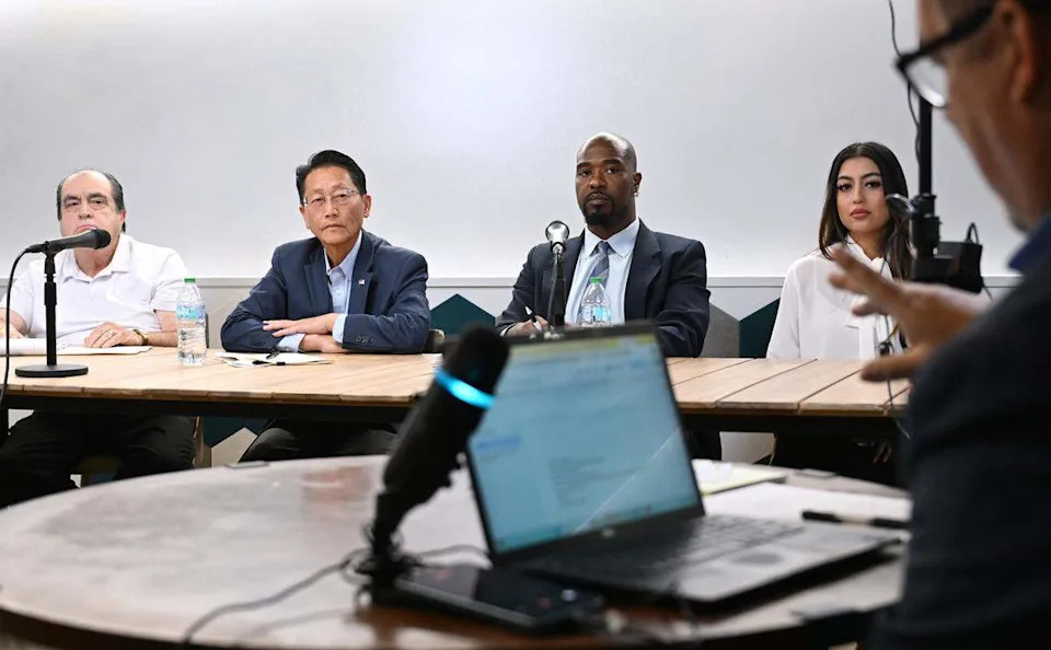 Fresno City Council District 5 candidates left to right, Jose Leon Barraza, Brandon Vang, Nicholas Wildstar and Danielle Parra listen to a question posed by the Bee's Christopher Kirkpatrick during a candidate forum held Friday, April 17, 2026 in downtown Fresno