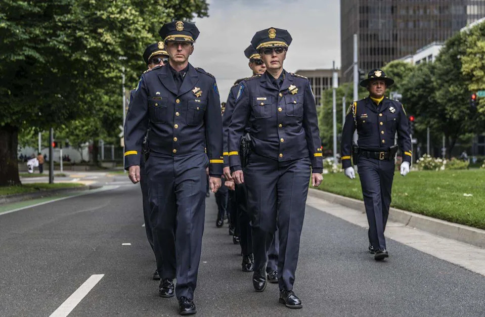 Retiring Sacramento Police Chief Kathy Lester, right, marches with her interim replacement Zachary Bales to the annual California Peace Officers’ Memorial enrollment ceremony in Sacramento on Monday. Lester will retire on May 15.