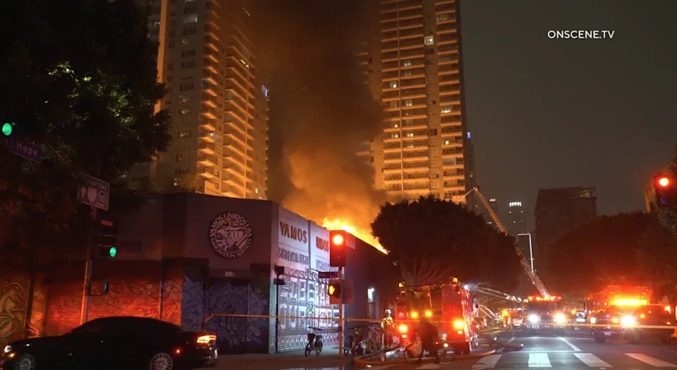 The structure — a two-story commercial building — caught fire and all units were ordered out of the building.