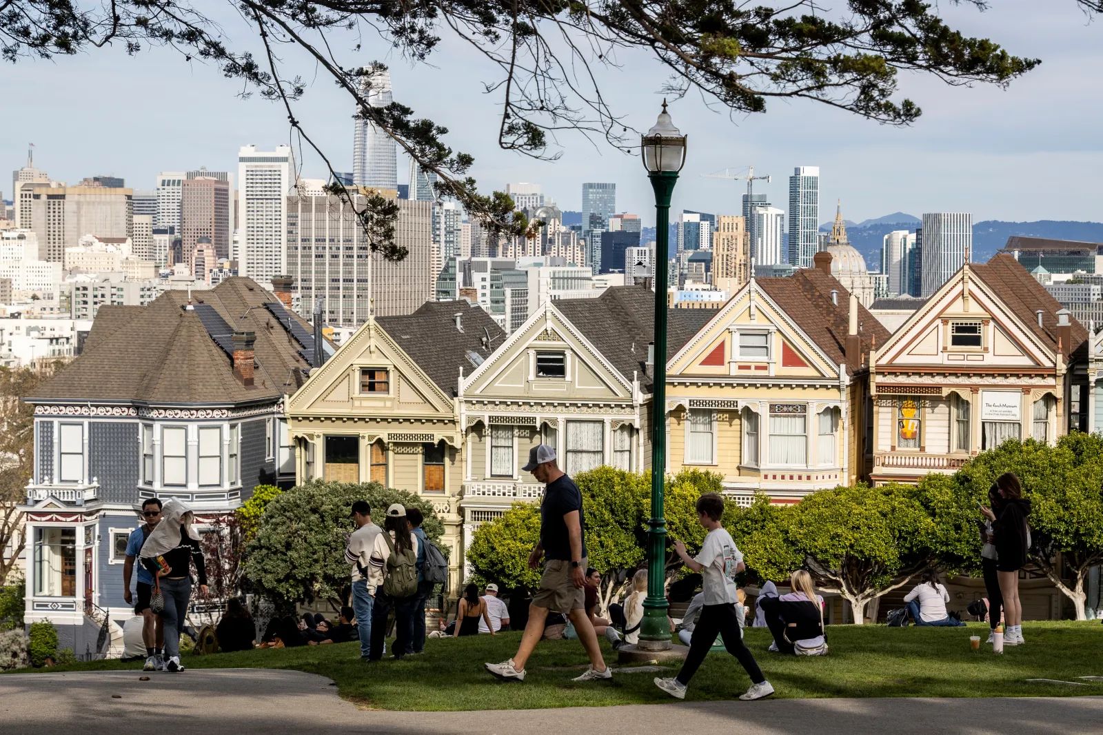 Visitors are seen at Alamo Square Park on an unseasonably warm winter day in San Francisco on February 27.