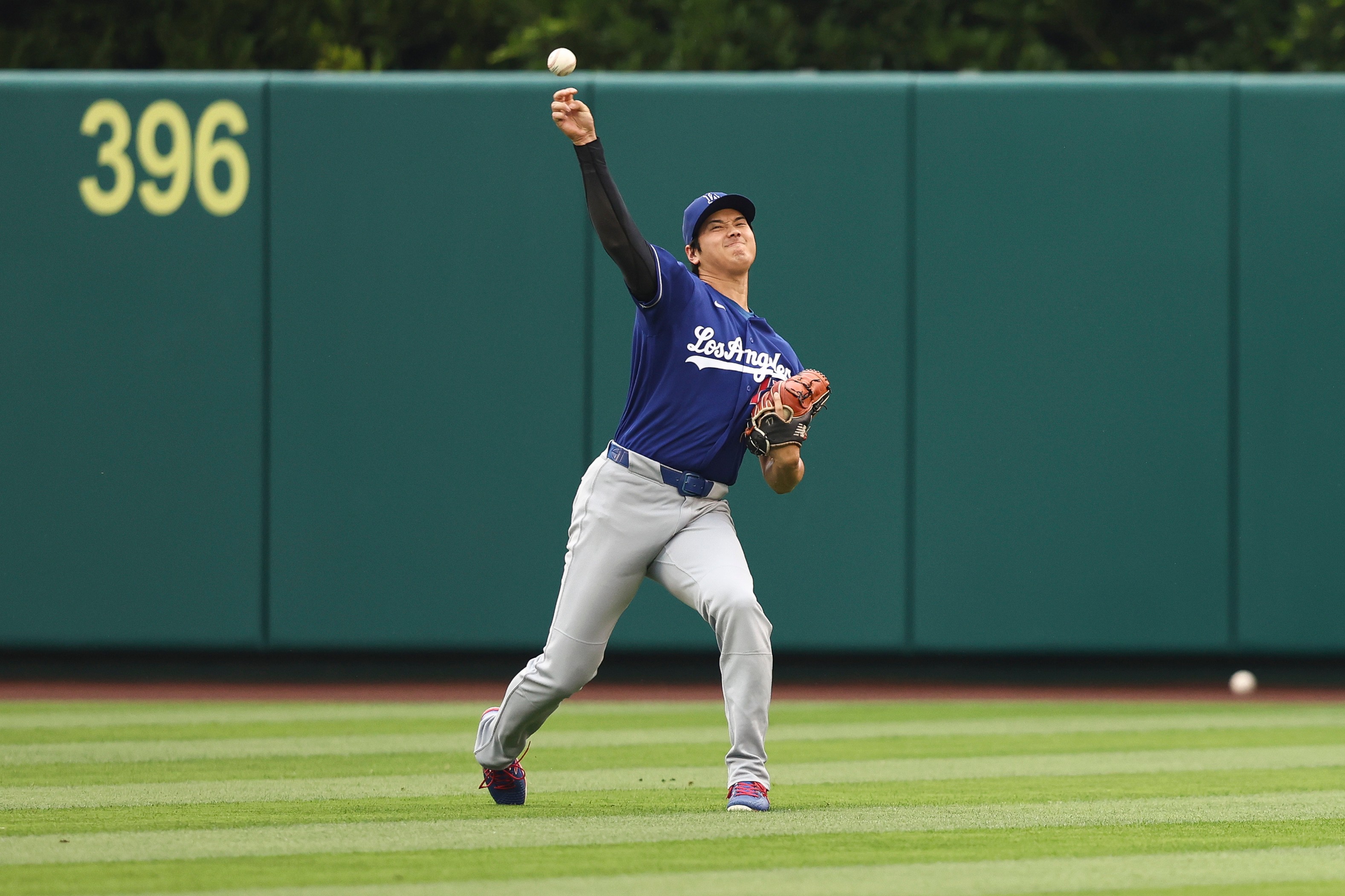 Dodgers’ Shohei Ohtani warms up before a baseball game against...