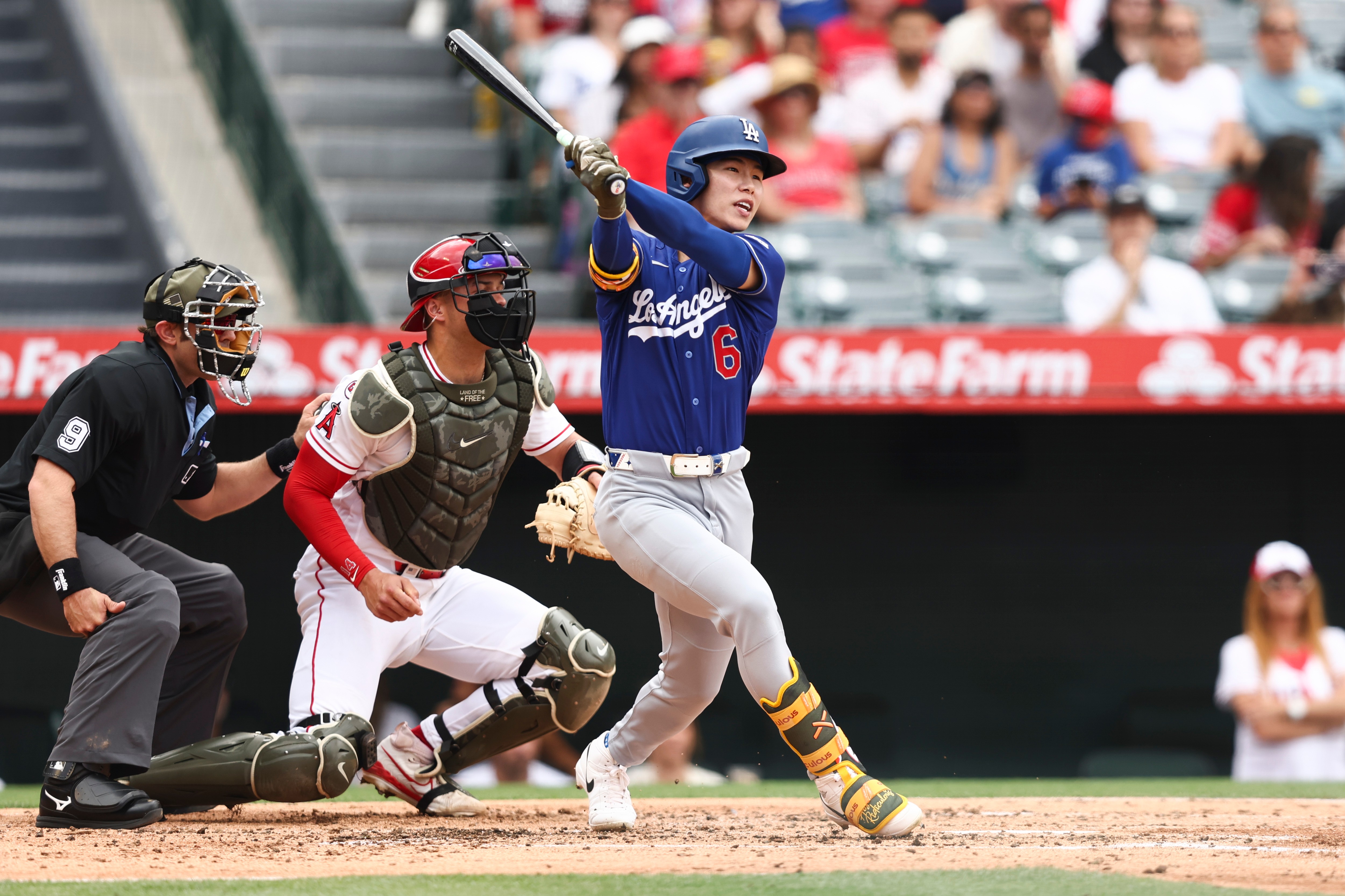 Dodgers’ Hyeseong Kim follows through on a swing after hitting...