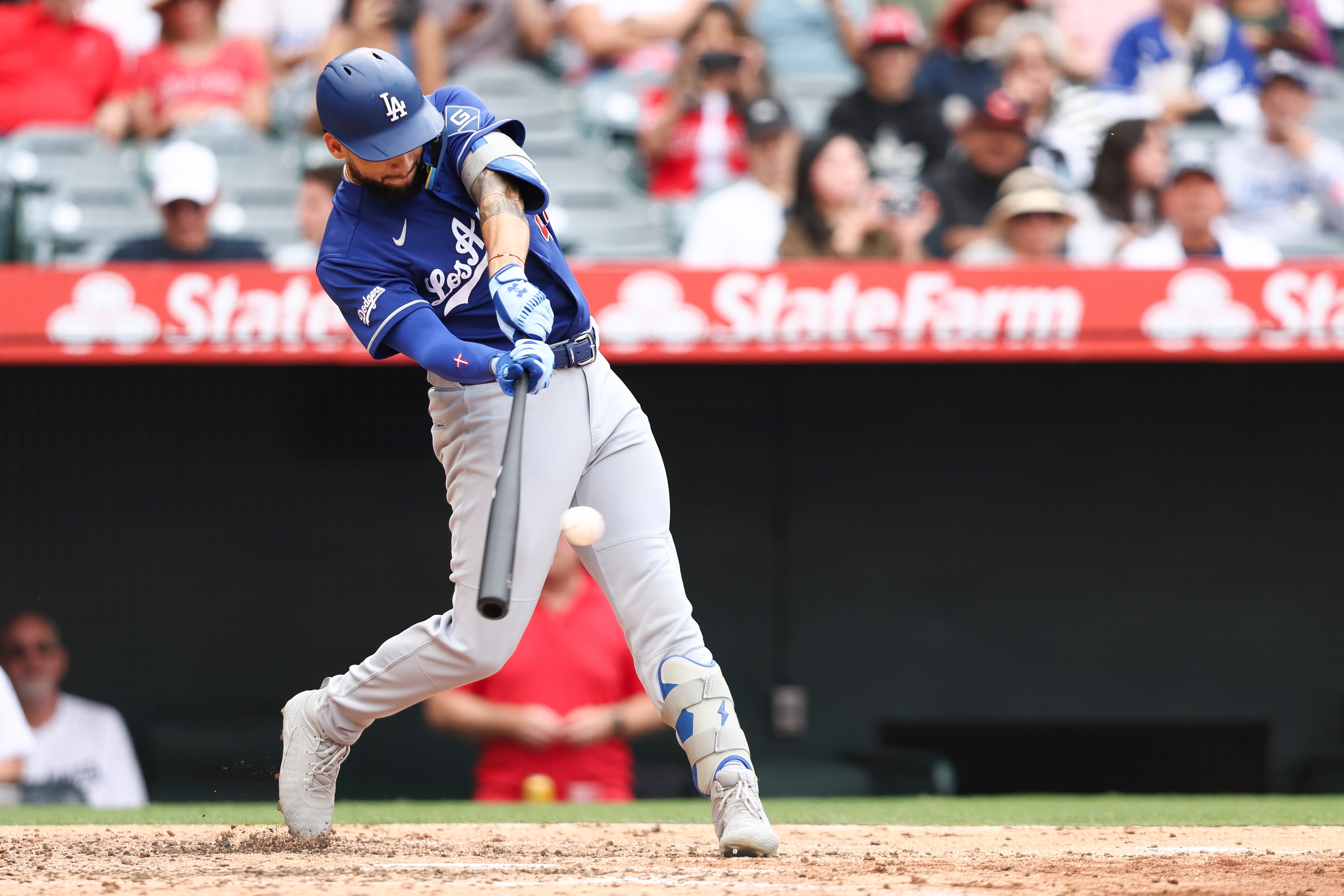 Dodgers’ Andy Pages hits an RBI single during the fourth...