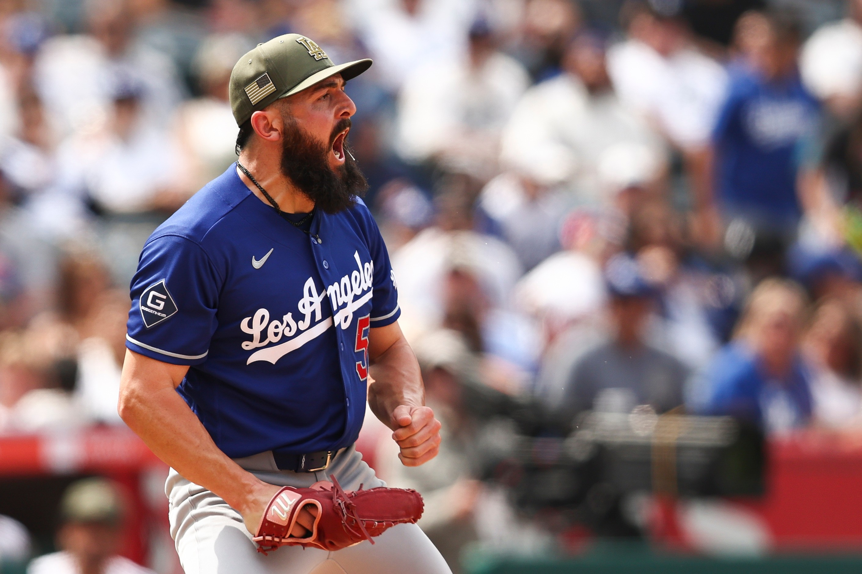 Dodgers pitcher Alex Vesia reacts during the eighth inning of...