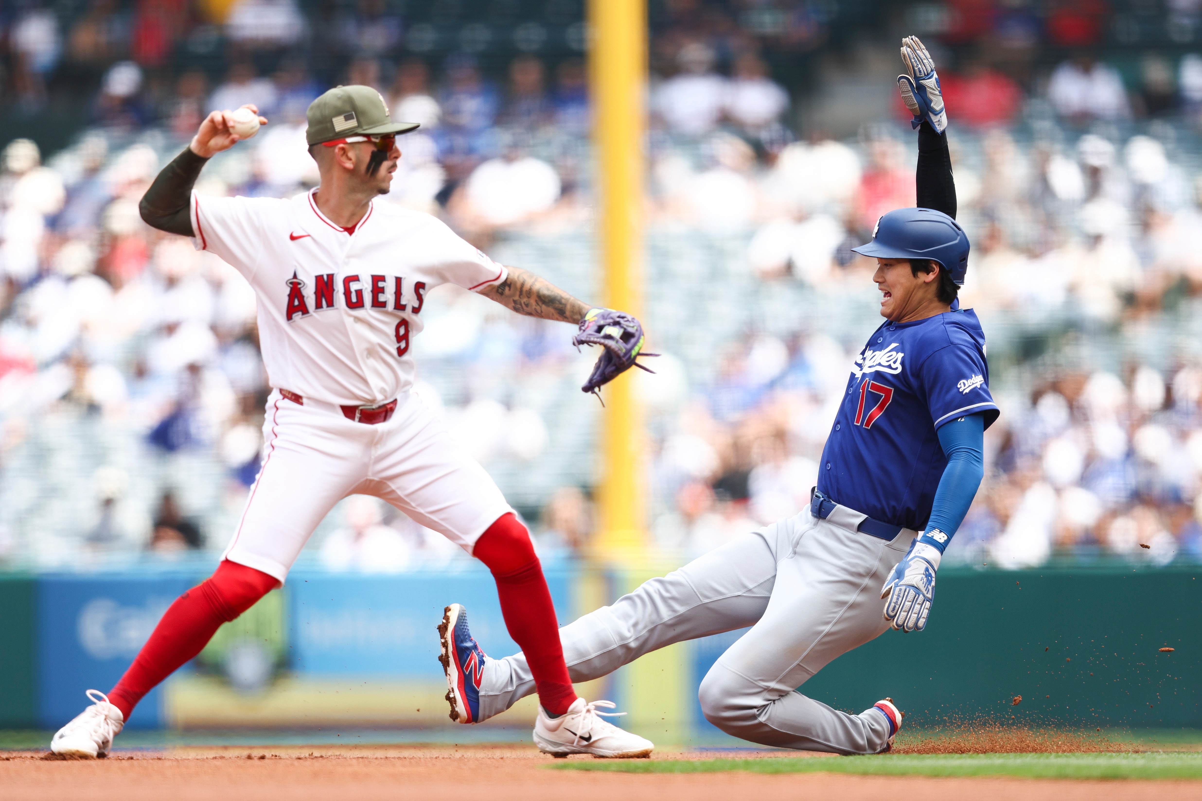 Dodgers’ Shohei Ohtani (17) slides into second base as Angels...